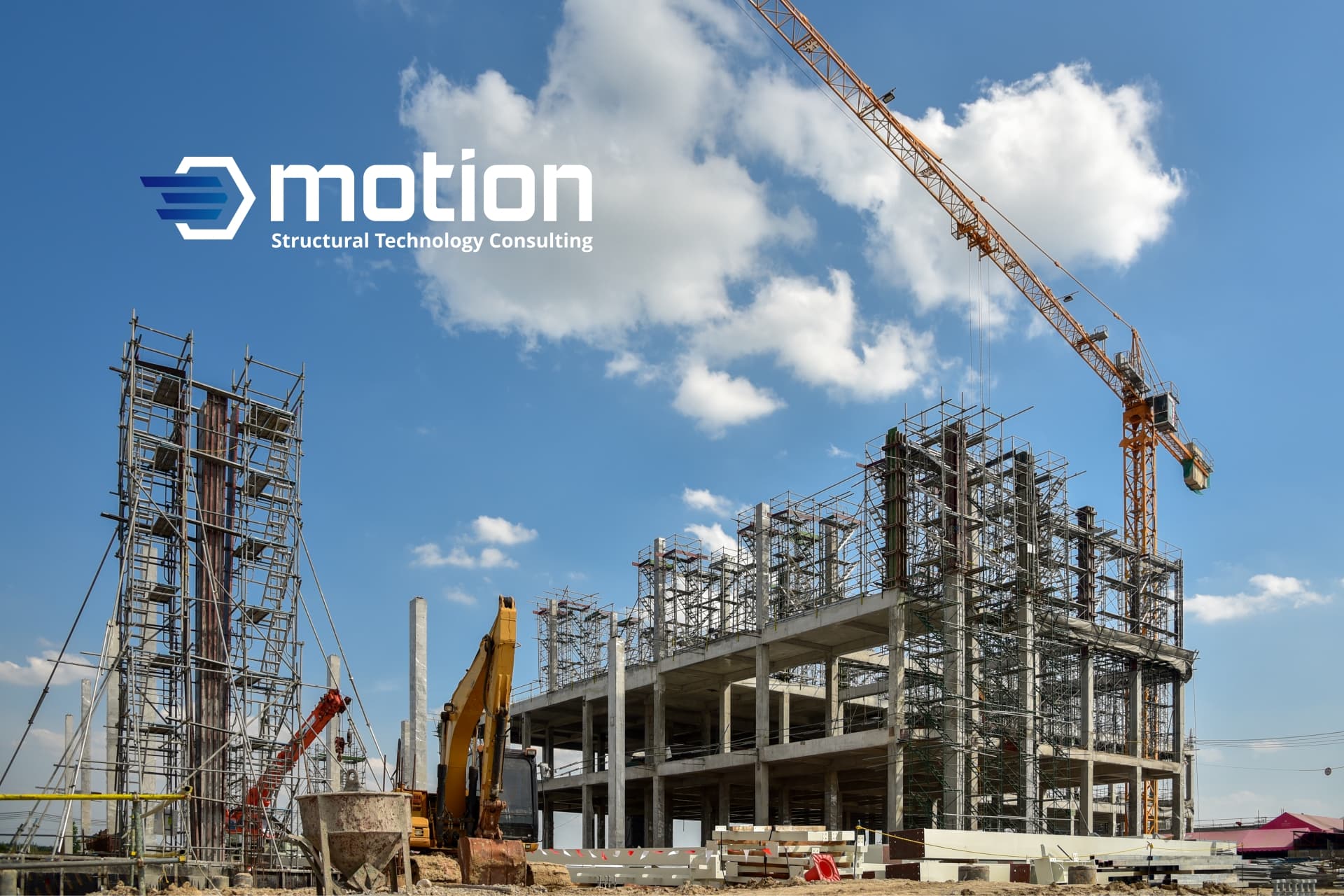 A construction site featuring a partially completed building, cranes and equipment prominently displays the STC Motion logo, a leader in civil and structural consulting engineering.